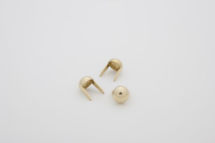 stud domes tiny golden product hero